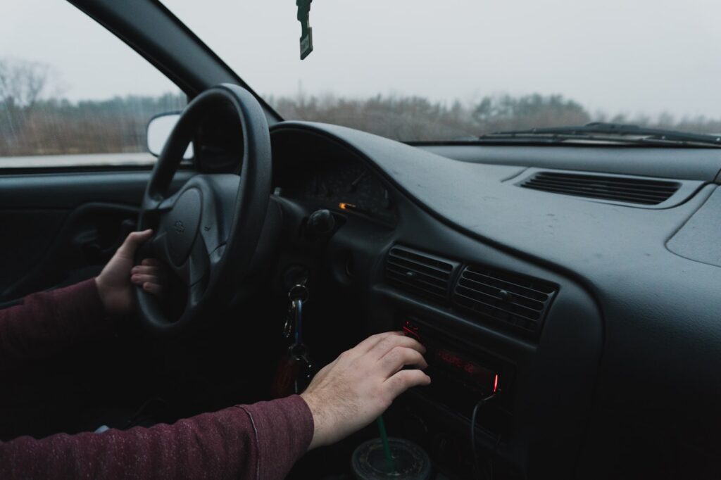 Driver behind the wheel on an open road