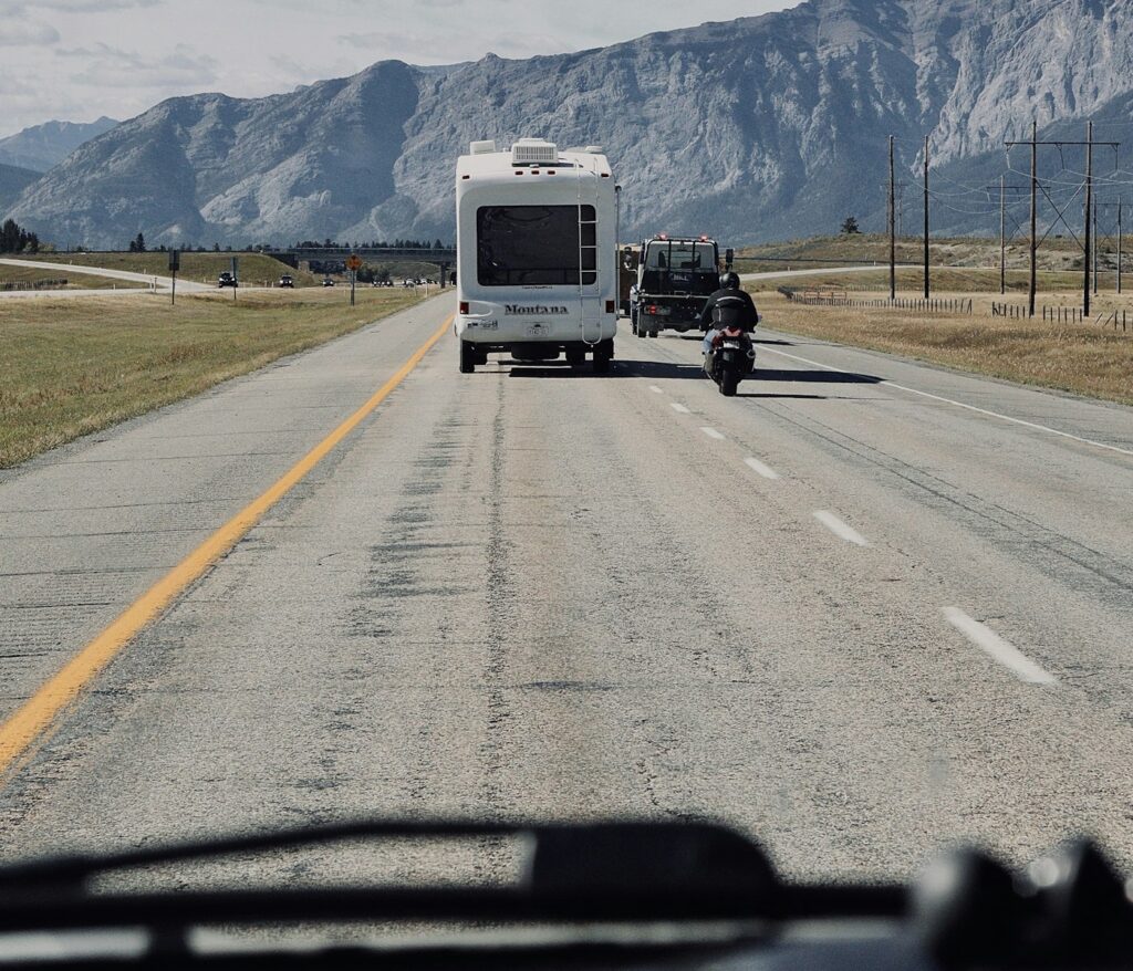 A motorcycle and a trailer on a mountain highway